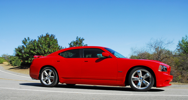 The styling is pure muscle car with a custom monochromatic Torch Red clear