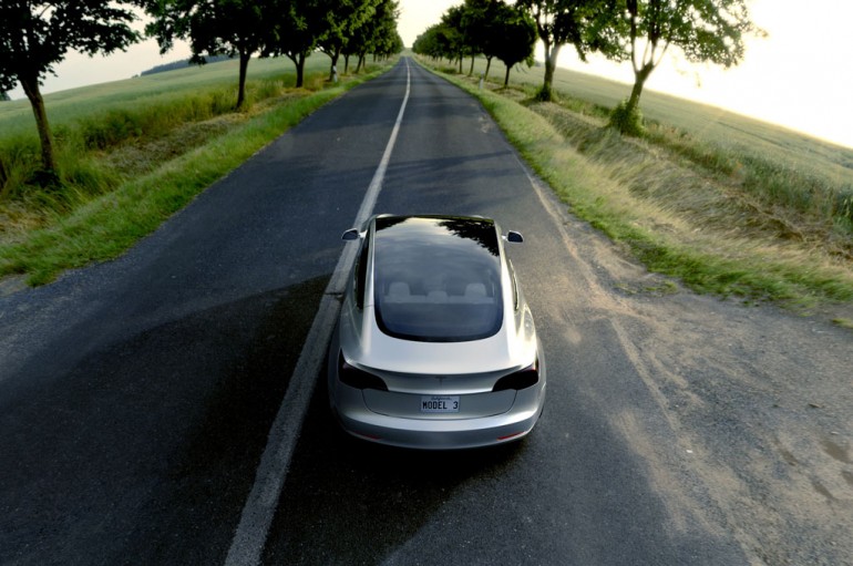 Tesla-Model-3-from-above-and-behind-with-open-road